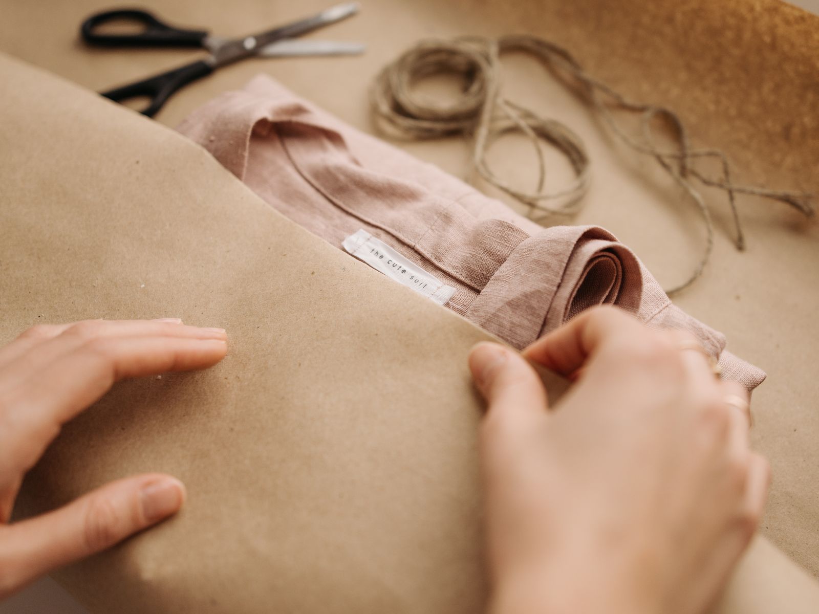 Folded linen being checked by hand