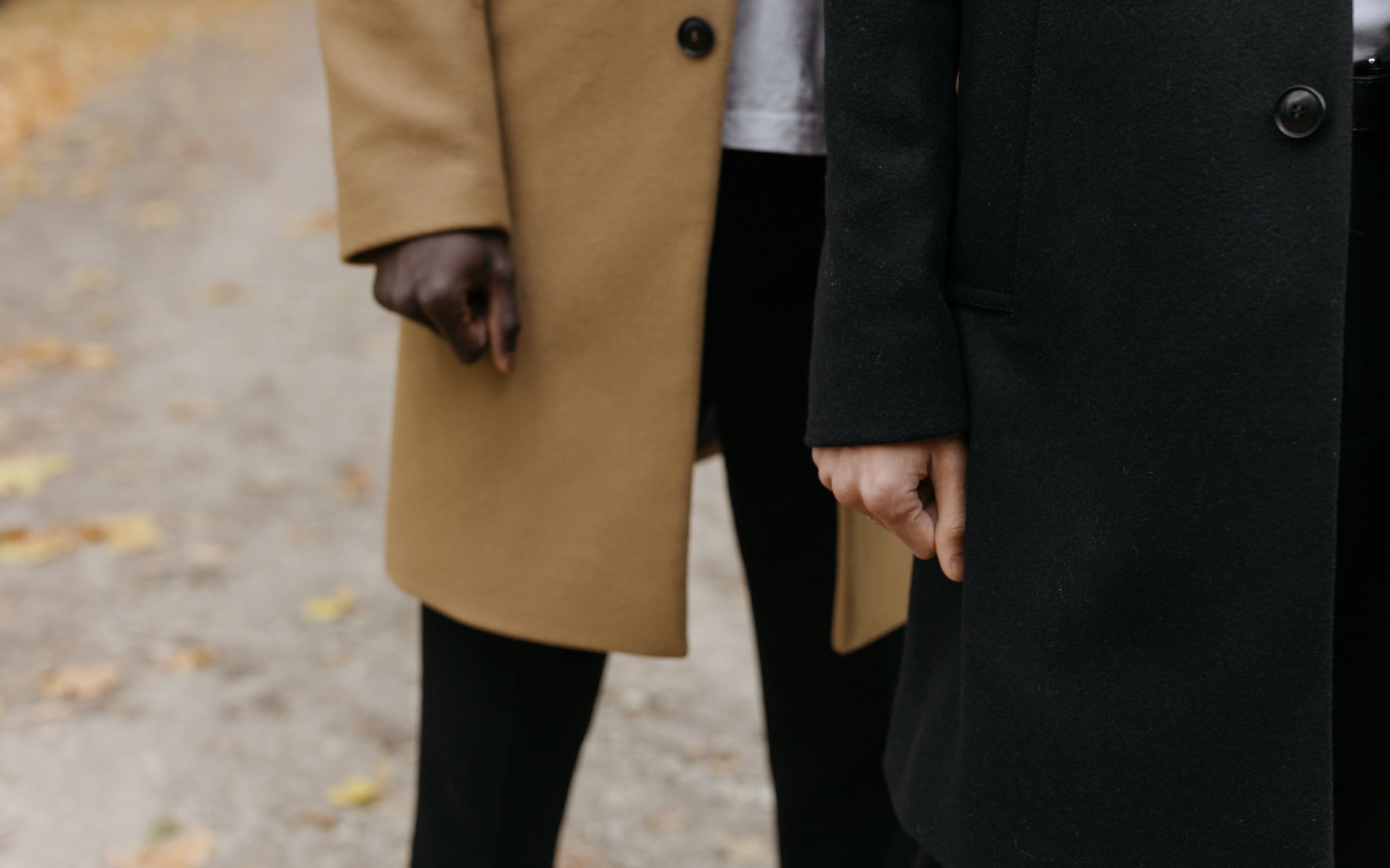 A coat photographed against a concrete wall