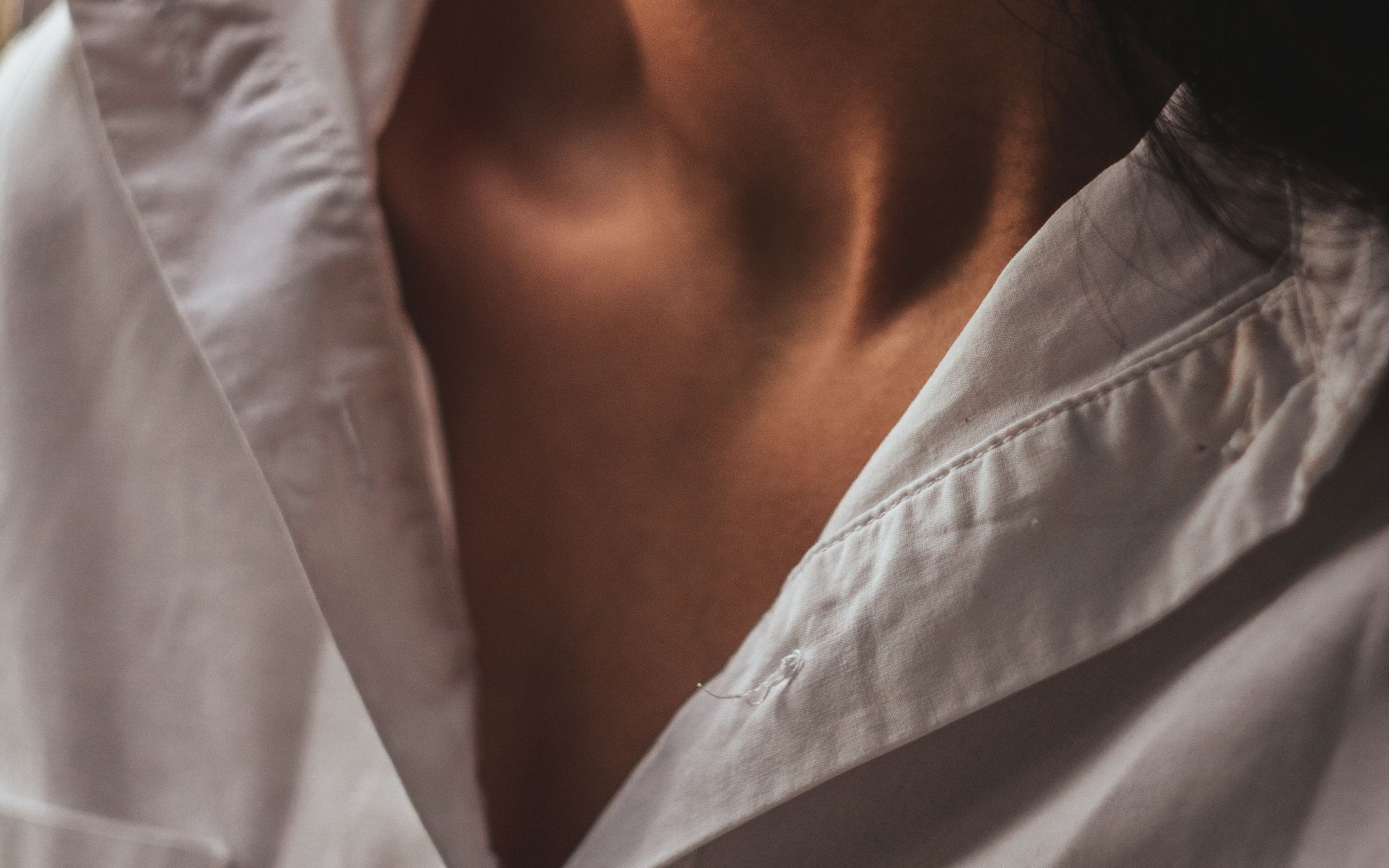 A rail of plain shirts