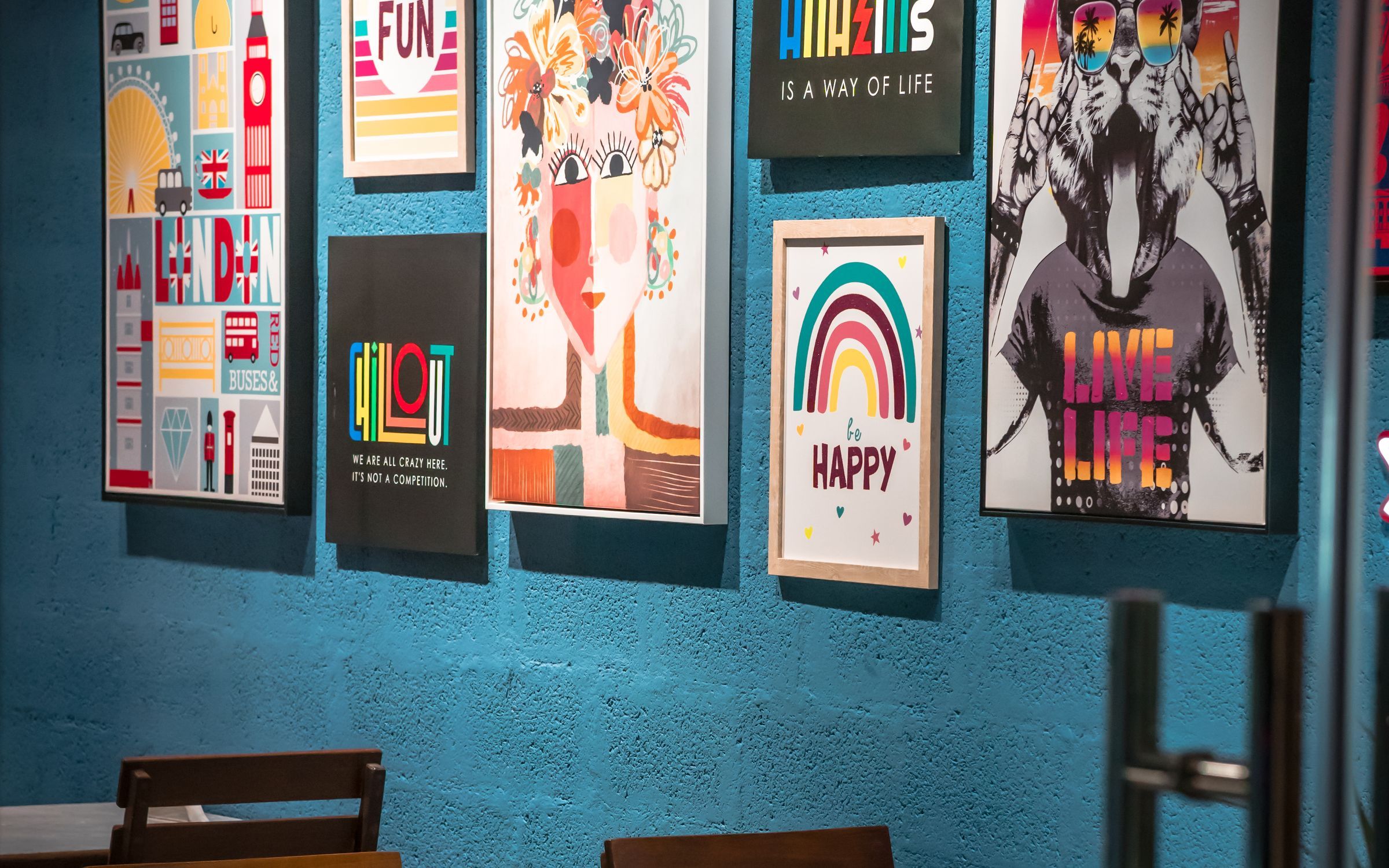 A wall of framed prints